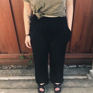 Stretchy, black wide leg pants .